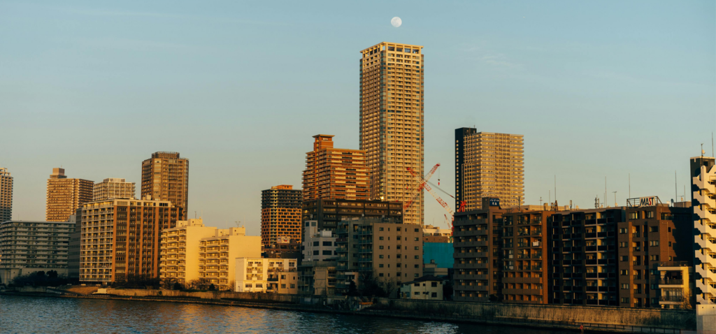 An image of Tsukushima Neighborhood from the water showing some high-rise residential buildings.