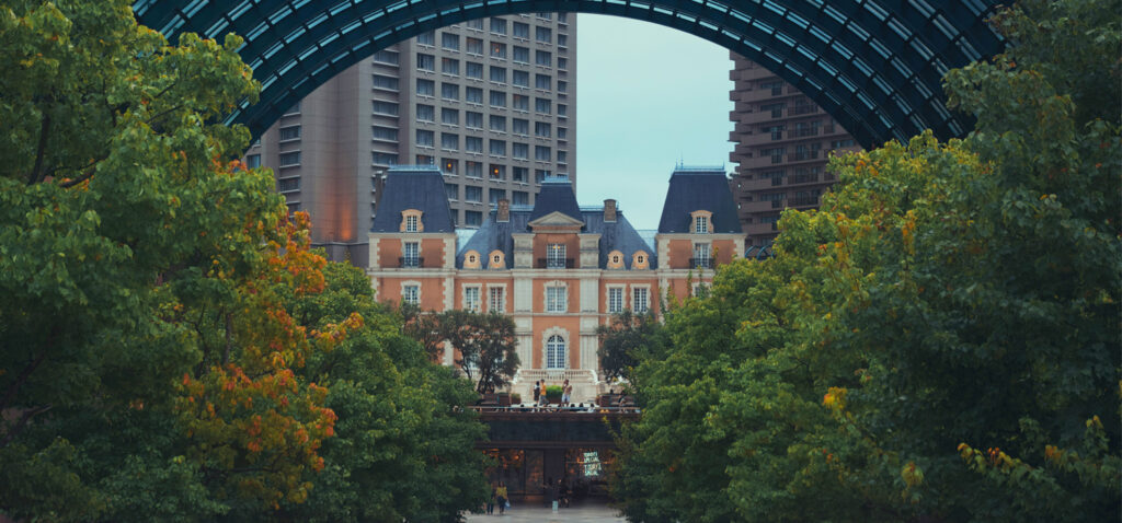 Yebisu Brewery under the archway at Yebisu Garden Place with trees in the afternoon